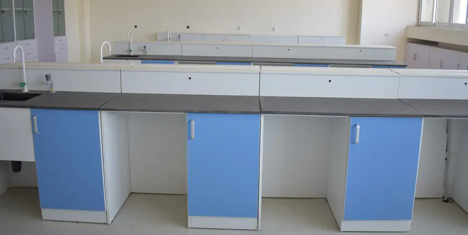 Laboratory benches with blue cabinet doors and chemical resistant worktops