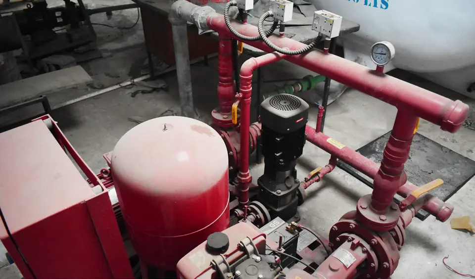 Fire pump with red pressure vessel