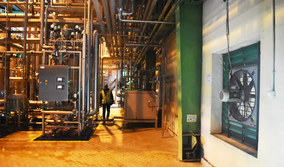Brewery production area with a wall-mounted industrial fan