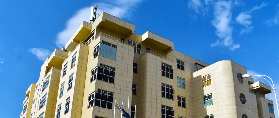 Multi-storey building with yellow facade in Modjo